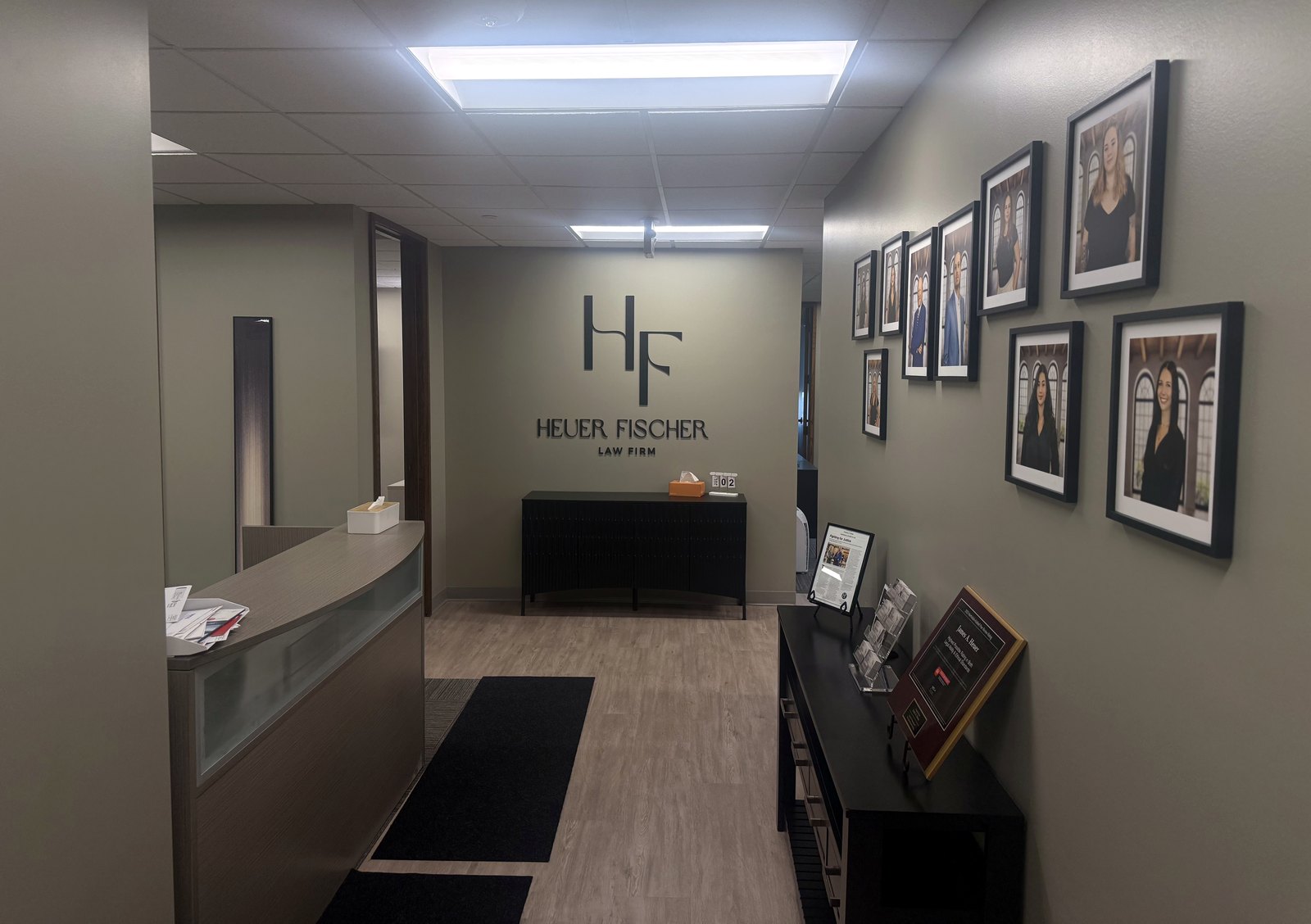Heuer Fischer reception area and attorney portrait wall